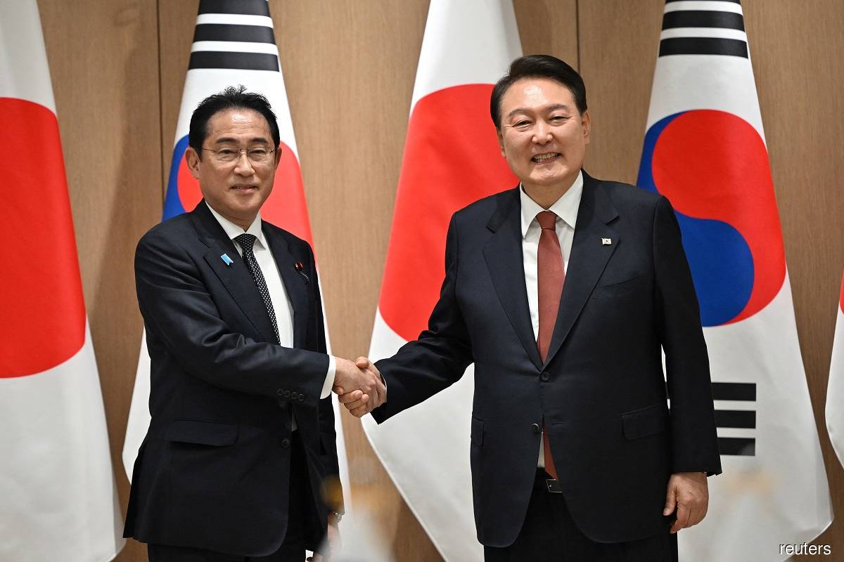 Japan's PM tells South Koreans his 'heart hurts' over pain caused by occupation